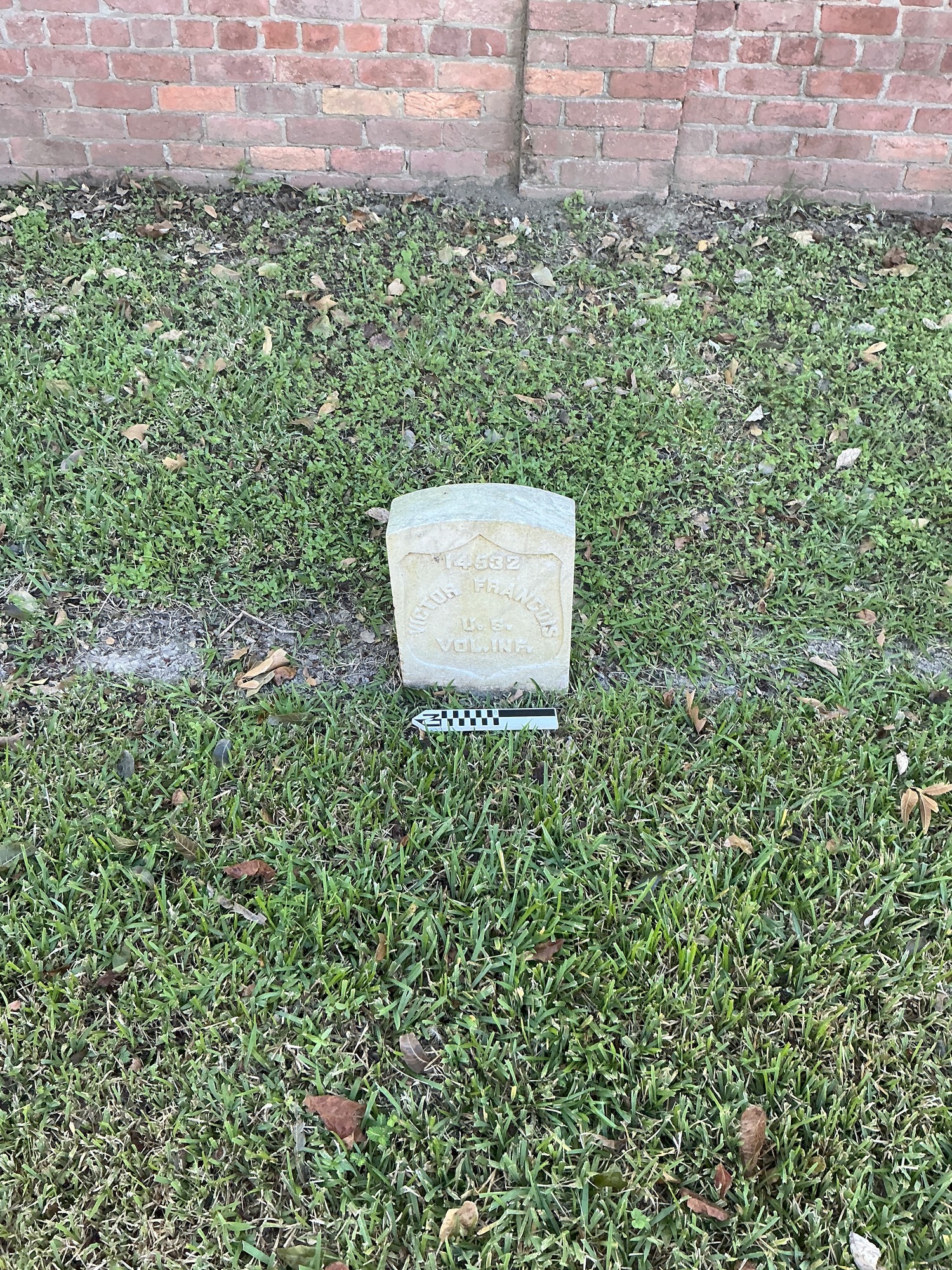 Extra image of historic upright marble headstone with recessed shield face.