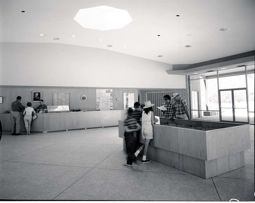 Mission 66 Visitor Center and Museum lobby with visitors.