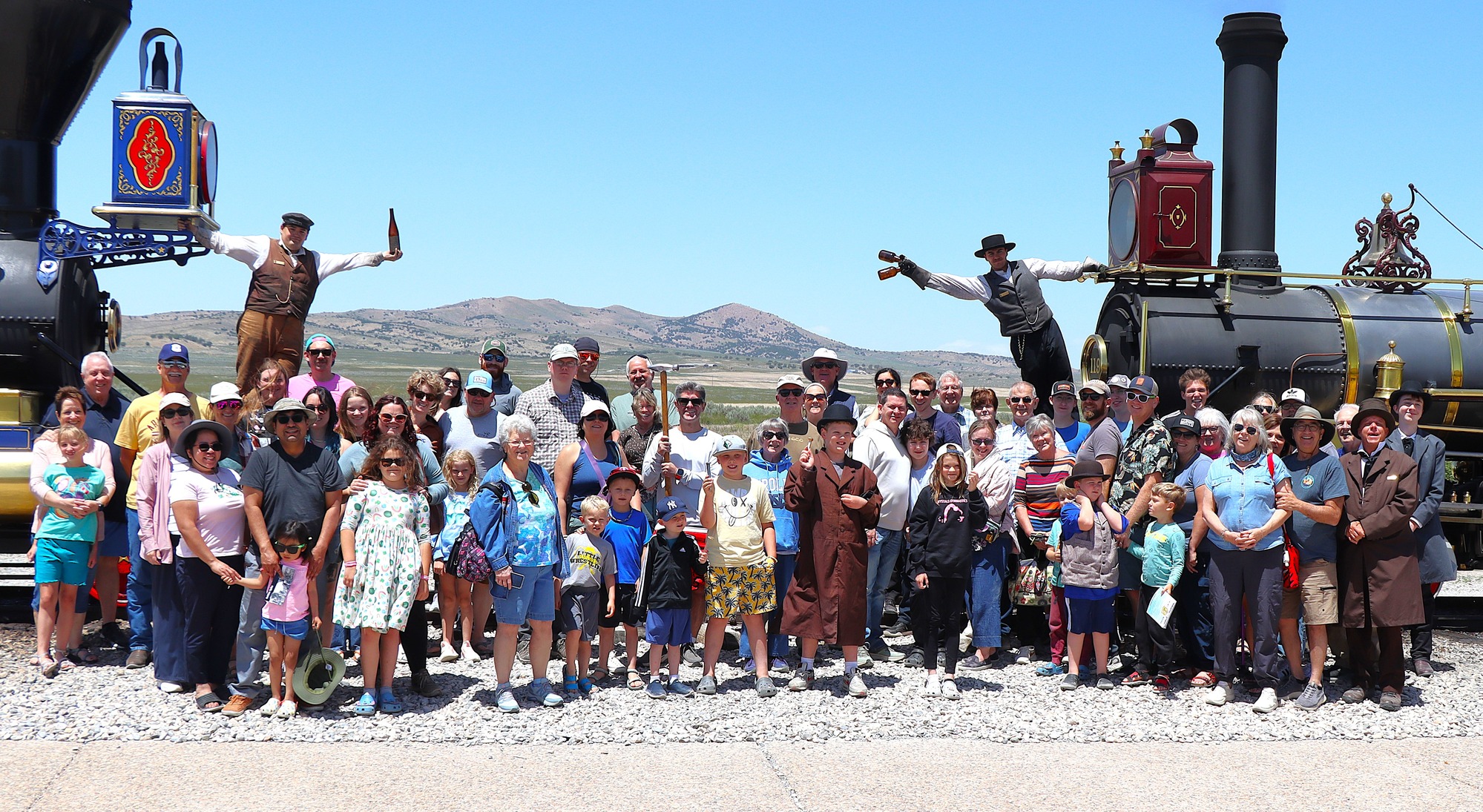 Visitors gathers to recreate the Historical Champagne photo in front of two historical replicas of the locomotives. 