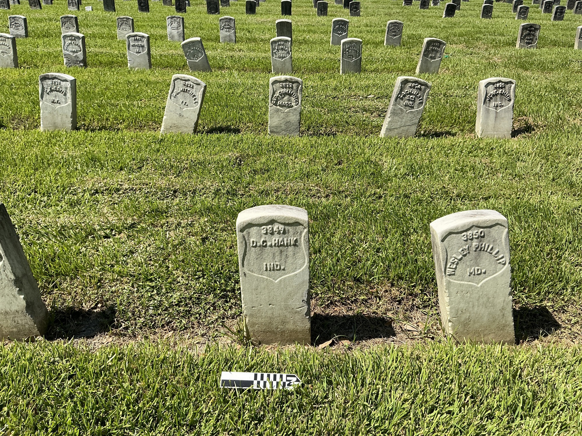 Extra image of historic upright marble headstone with recessed shield face.