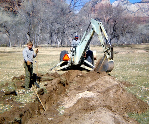 Excavator and workers during the Zion Lodge utilities project.