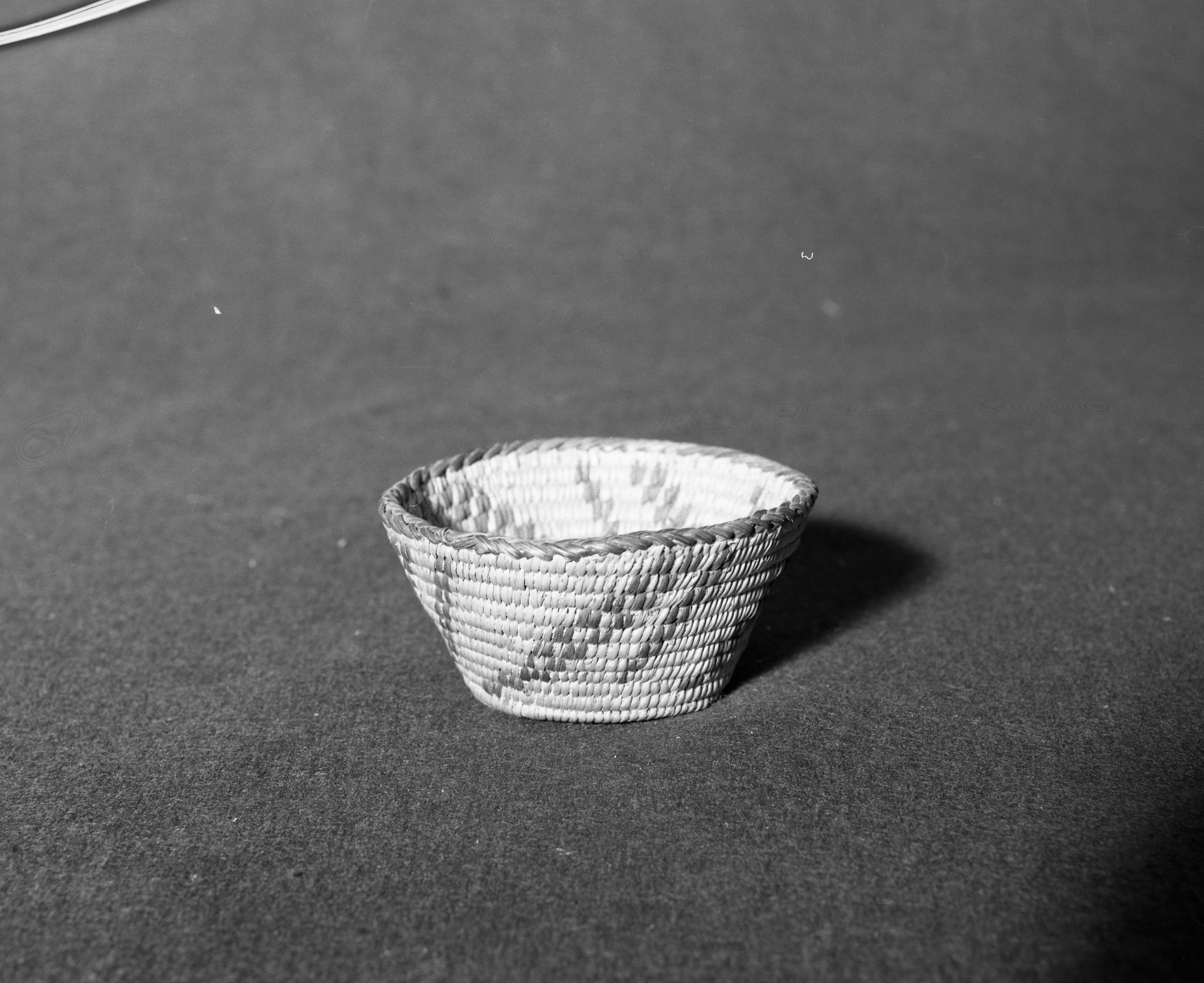 Marie Rozier Collections; Catalog No. 166. Object: Pima basket. Dimensions: 4 x 2". Materials: willow, devil's claw, cattail stem. Technology: herringbone rim finish. Collection History: Gift of Ora Doyle. Photographed by Michael Dixon, Dec. 1982. Catalogued by Craig Bates and Barbara Beroza. Yosemite Collections, National Park Service.