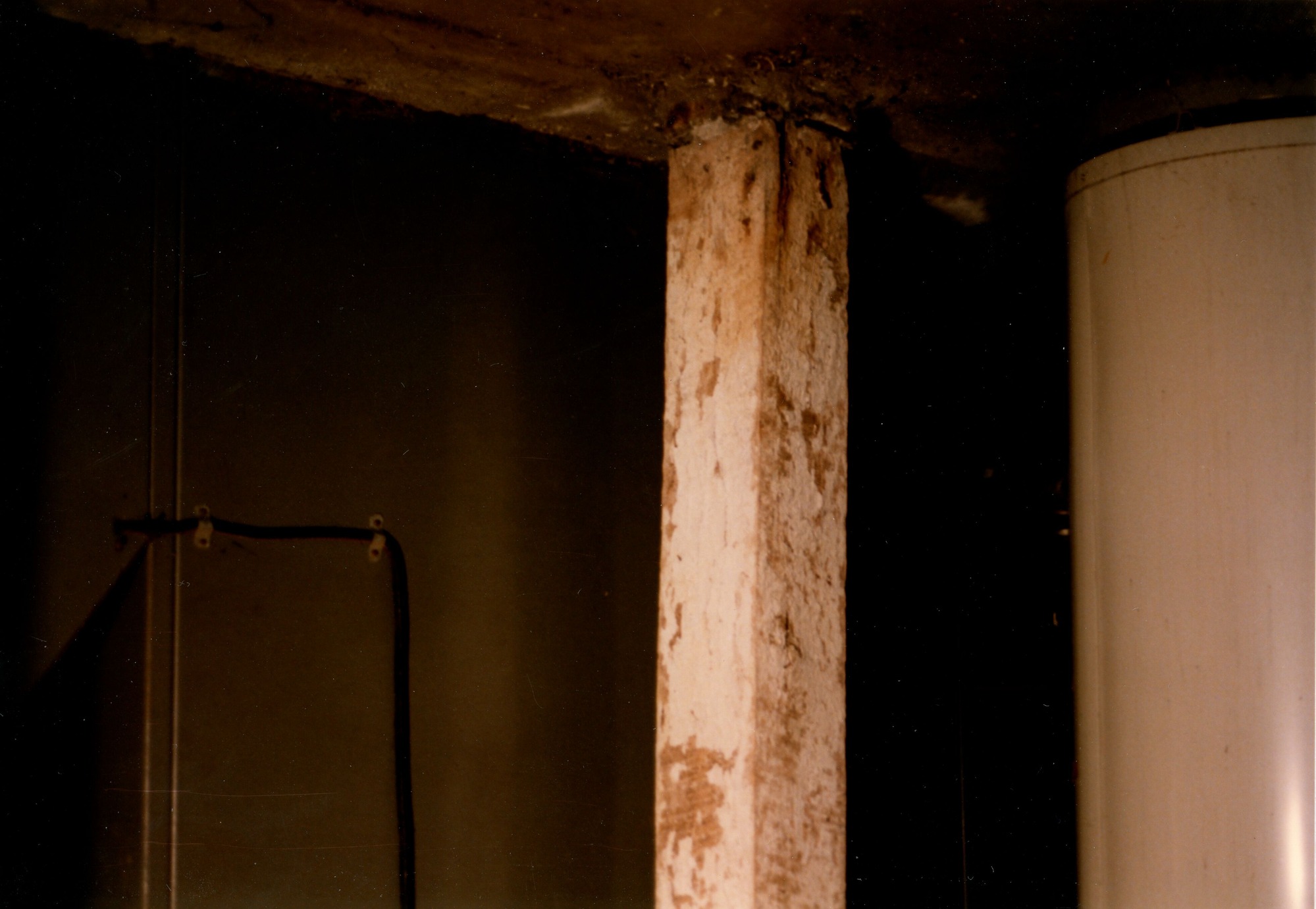 North side of furnace and water heater