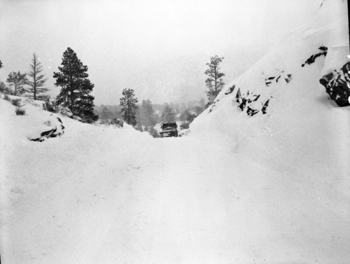 Snowplow removing snow after a snow slide on Checkerboard Mesa.