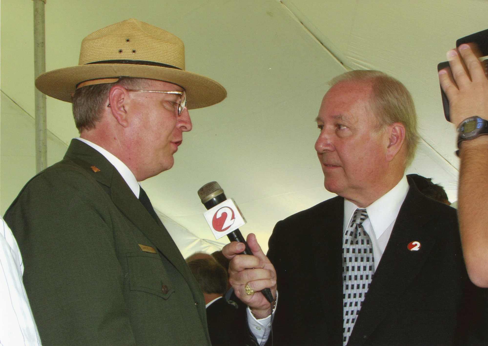 A reporter interviewing Park Ranger