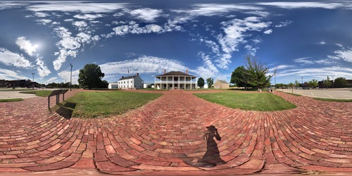 Brick walkways leading to two story building