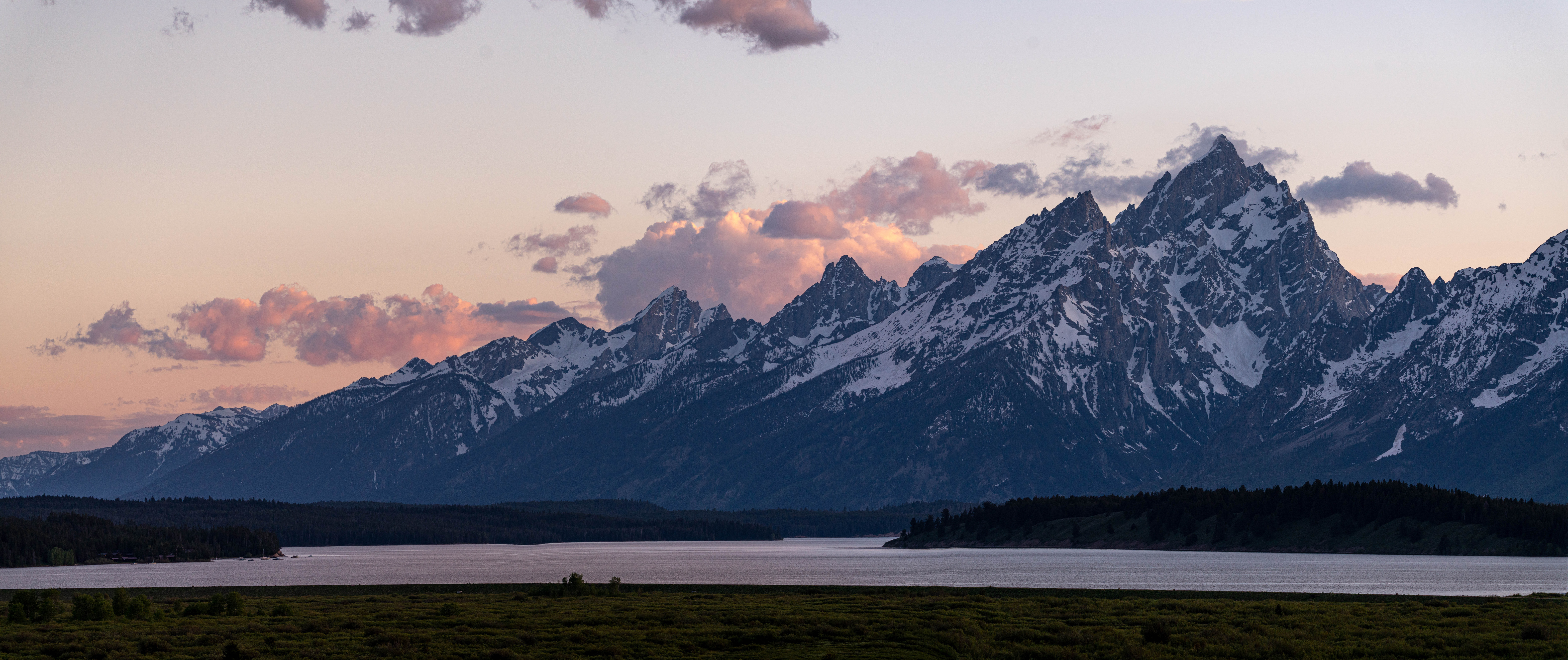 Mountains rising up from a lake in a valley.