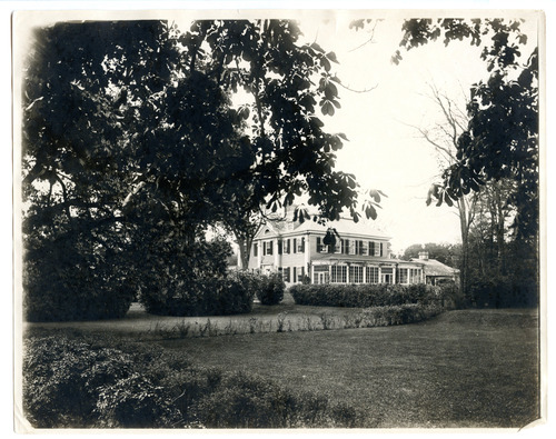 Black and white photograph of corner of Georgian mansion.