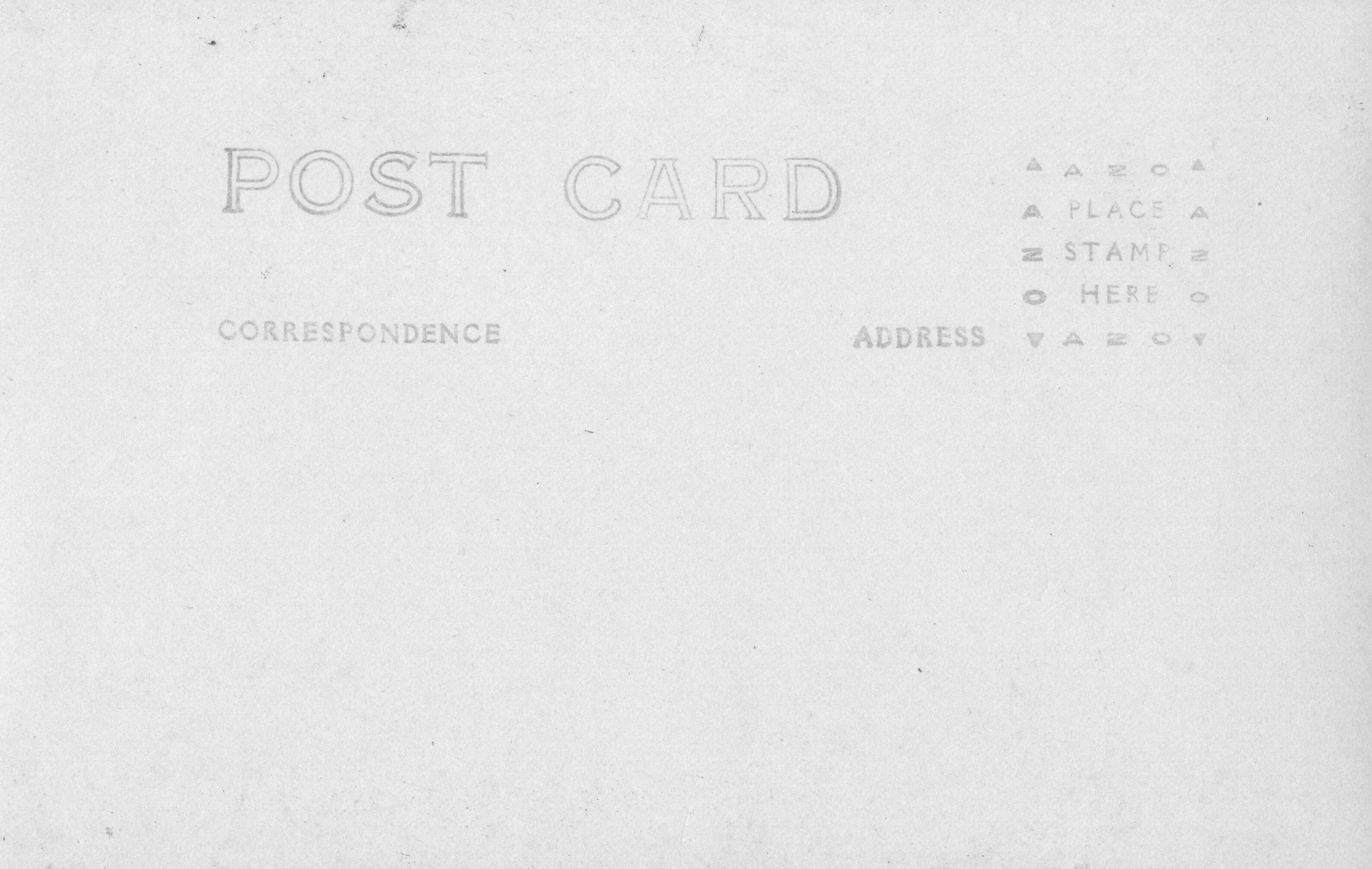 The backside of an image of Laie Hawaiʻi Temple. The words "Post Card" are centered on the card, along with the subtitles "Correspondence"and "Address" under it. There is a box outlined with "AZO" and triangles on each corner, with the instructions "Place stamp here" at the center. There is no address, correspondence, or stamp.