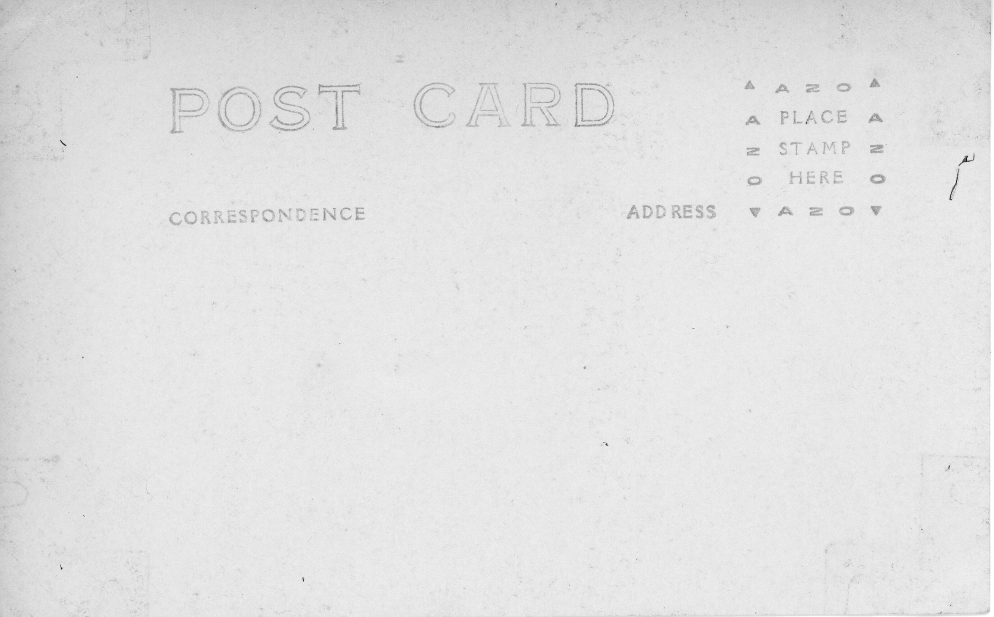 The background color of the postcard is white with writing on the left side of the post card that has “Post Card” as the heading in all caps. The postcard does not have a divided back. Below "Post Card" it reads “Correspondence.” To the right of "Correspondence", it reads “Address.” At the very right corner of the post card is the stamping box. The stamp box is a small square that has configurations on each side of the square that reads “AZO.”At each corner of "AZO" there is a triangle. The top of the square has two upwards facing tringles before and after "AZO." The bottom corner of the square has downwards faced triangles at each end of "AZO." The inside of the square reads “Place Stamp Here” in all caps.