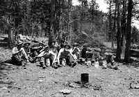 hpc-000078.jpg. CCC (Civilian Conservation Corps) workers at lunch, Cow Creek, Rocky Mountain National Park.