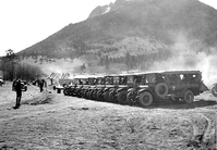 hpc-000080.jpg. Buses loaded with CCC (Civilian Conservation Corps) workers ready to depart from camp to the various places on the job - woods, roads and trails, Rocky Mountain National Park.