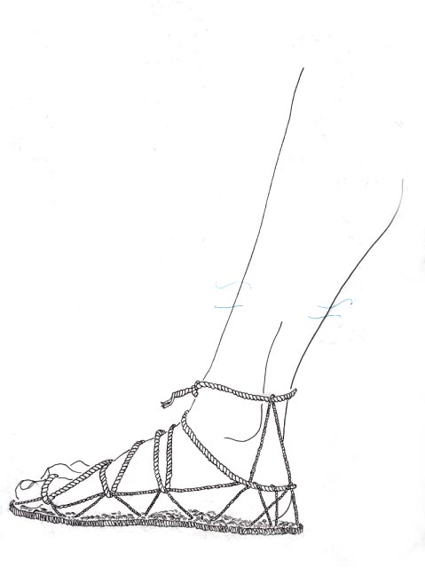 A sandaled foot of twilled yucca with cords.