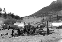 hpc-000077.jpg. CCC (Civilian Conservation Corps) Camp and the woodpile at Rocky Mountain National Park.