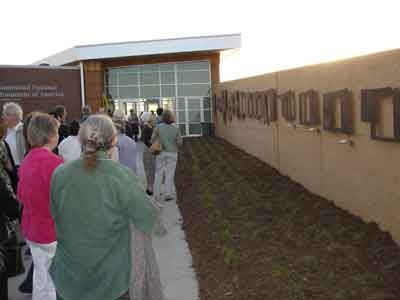 Visitors at the Living Wall which shows the percentage of each state that was successfuully homesteaded