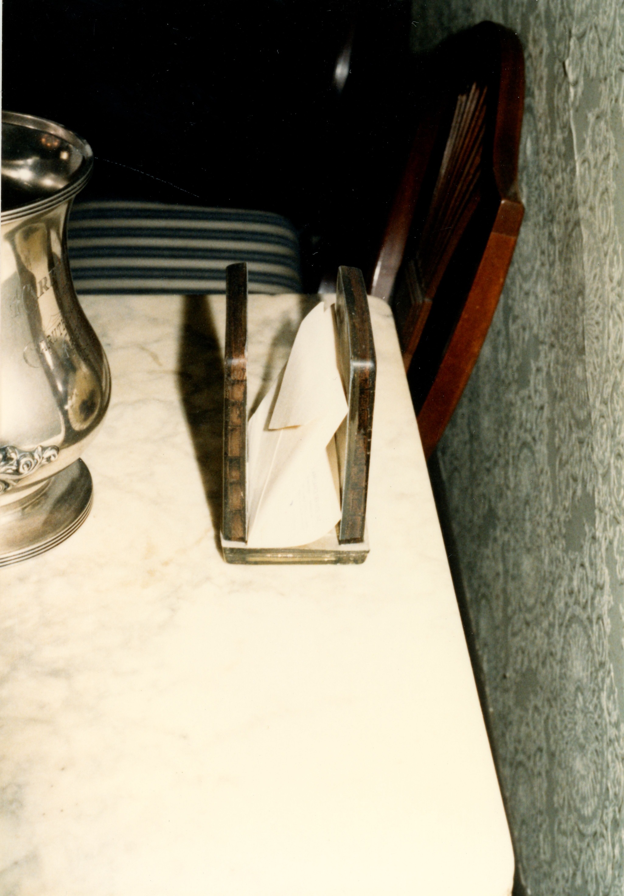 Holder on top of plate warmer in dining room