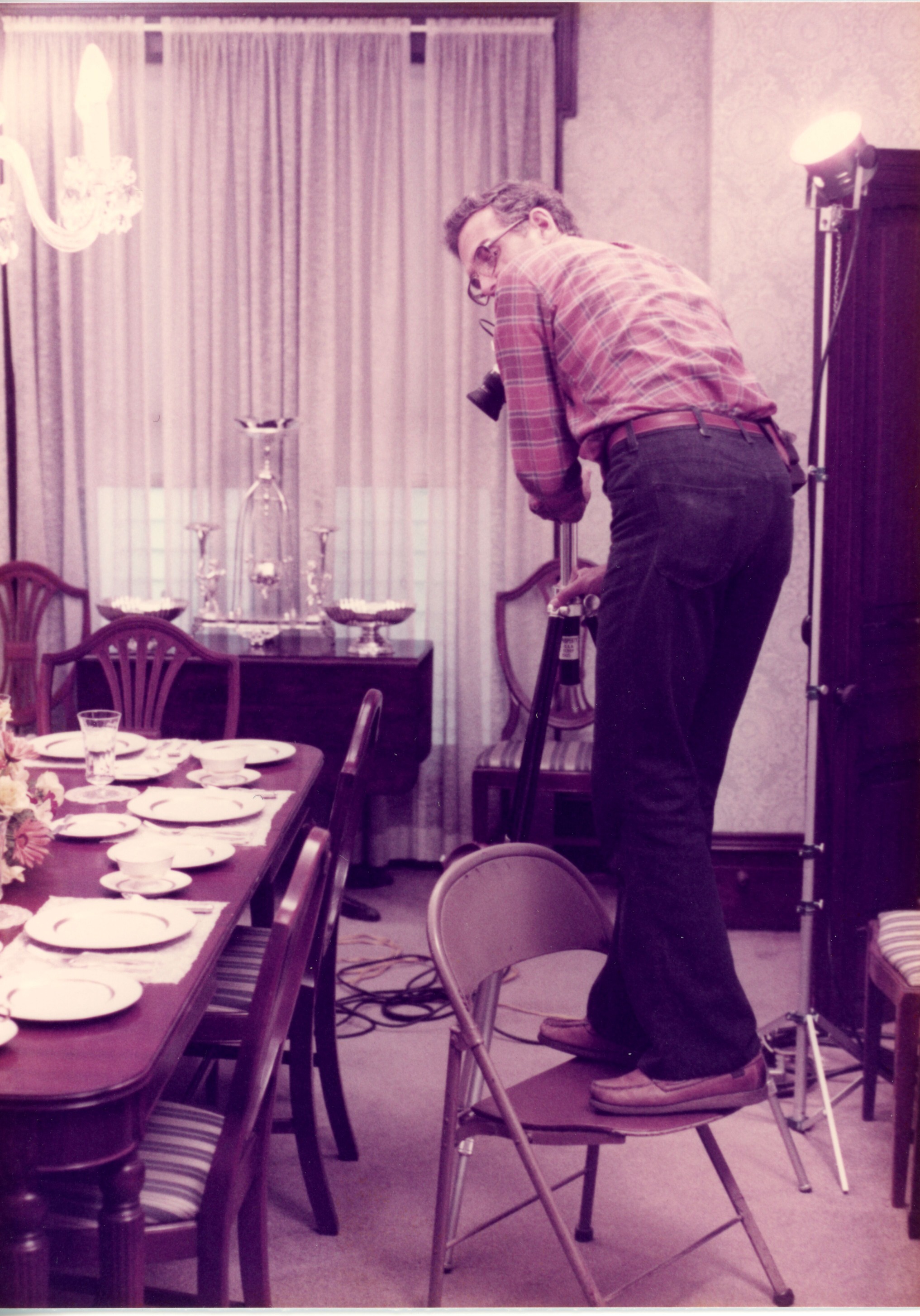 Photographer capturing dining room