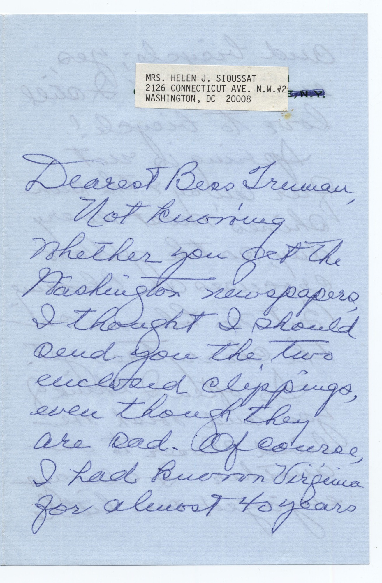 A letter written in blue pen on light blue paper.
