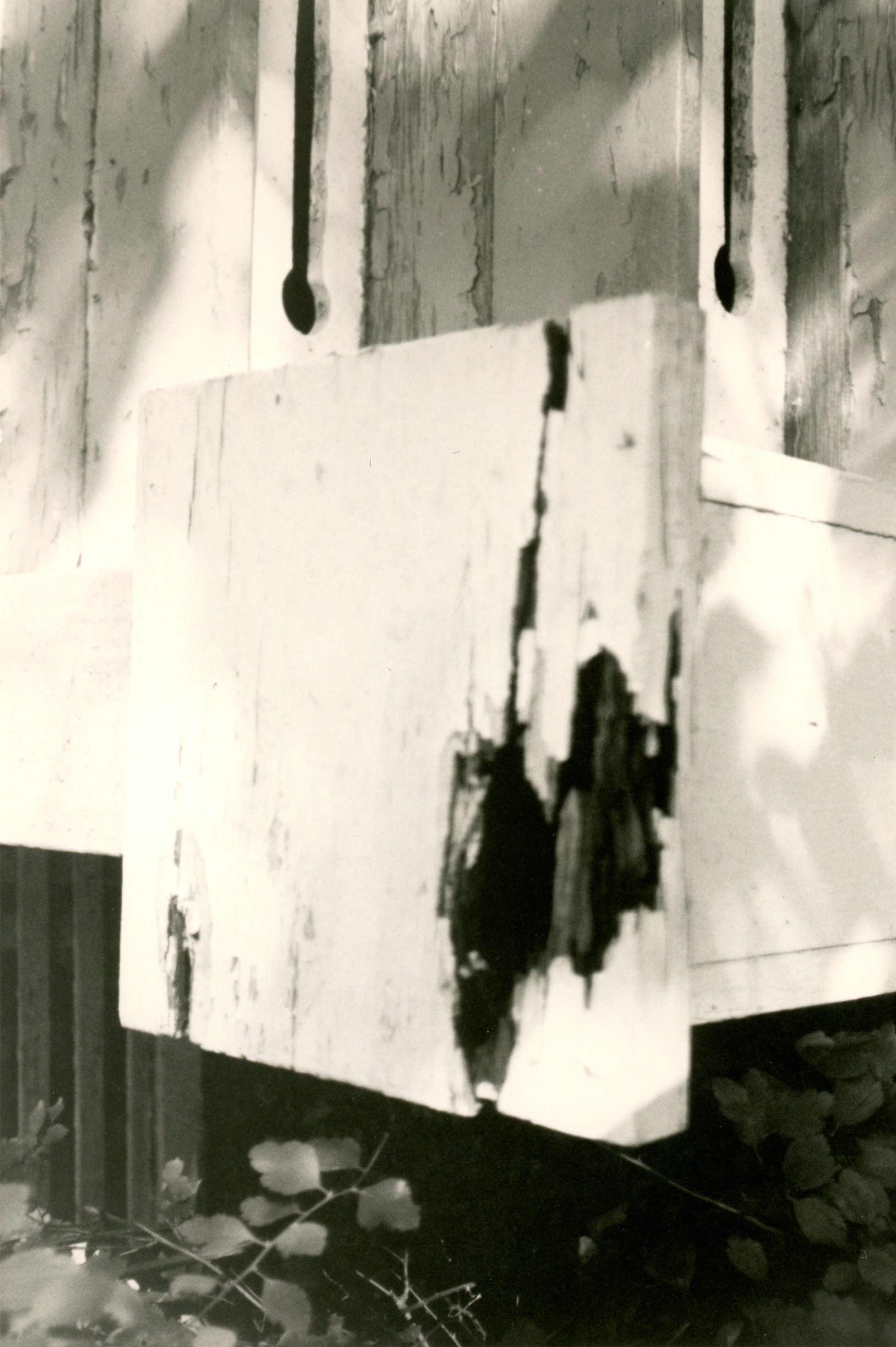 Closeup of broken newell on SW side porch steps