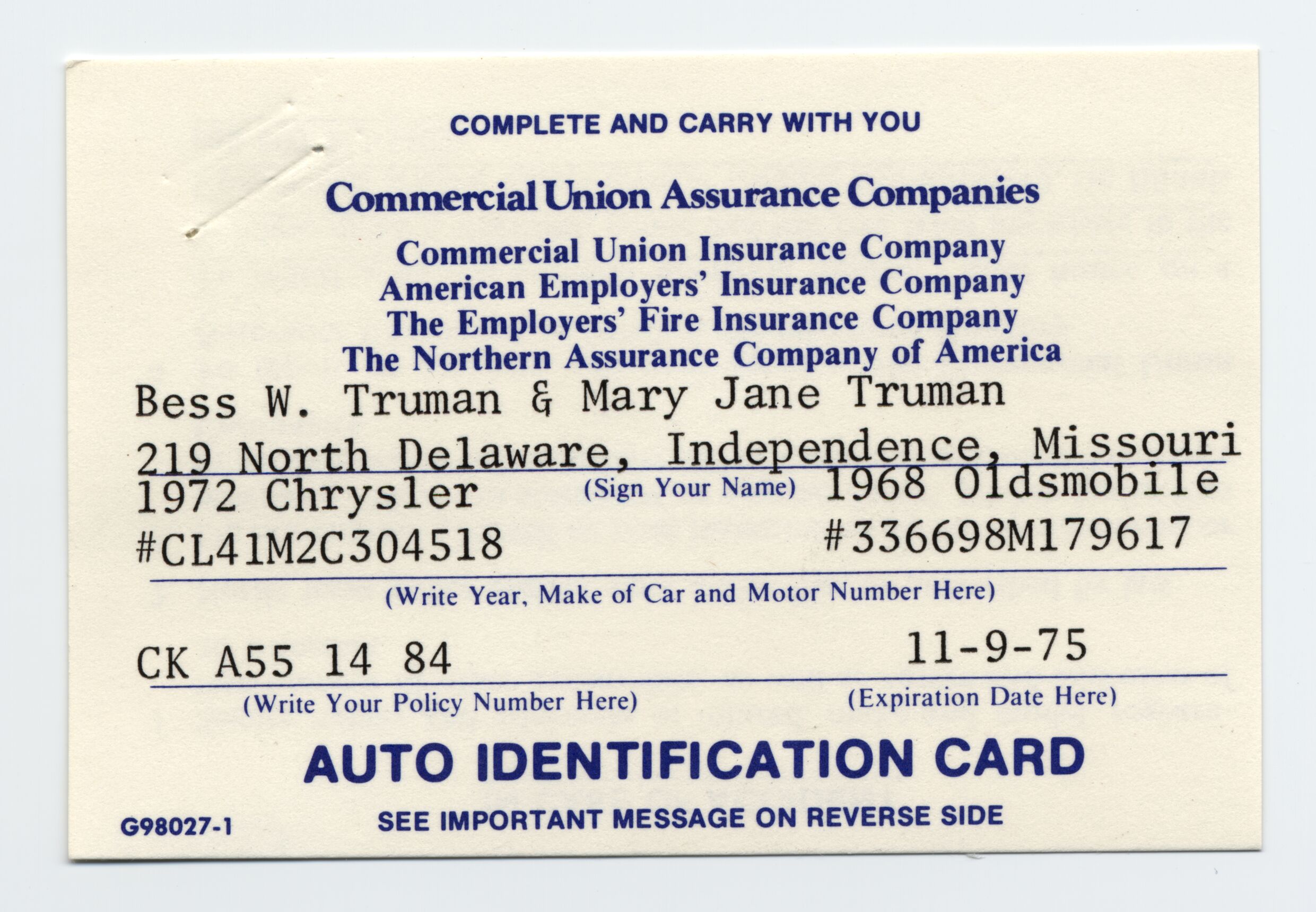 A card with blue printing and typed information.