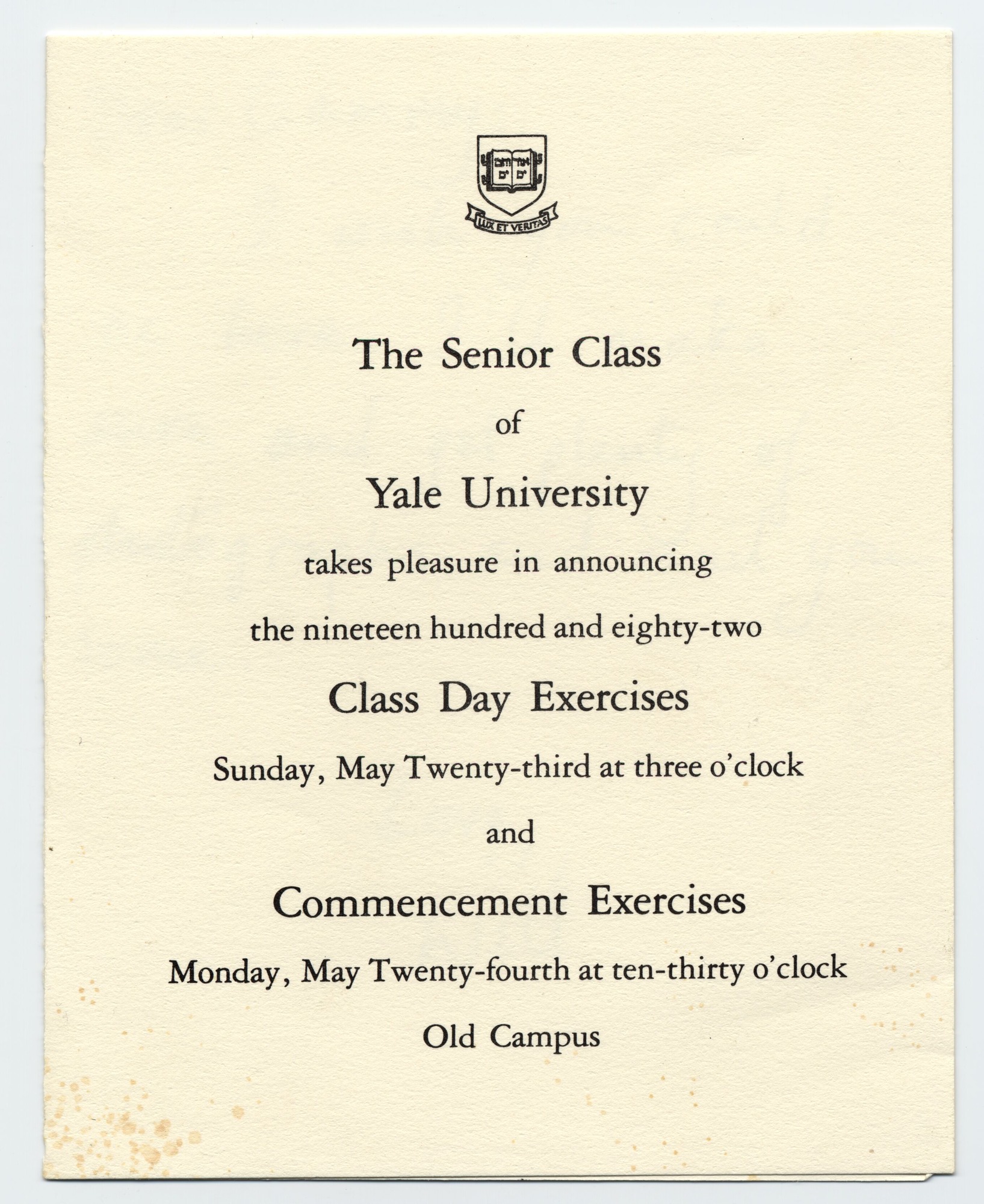 A small card with information printed on the front and a note written in black ink inside.