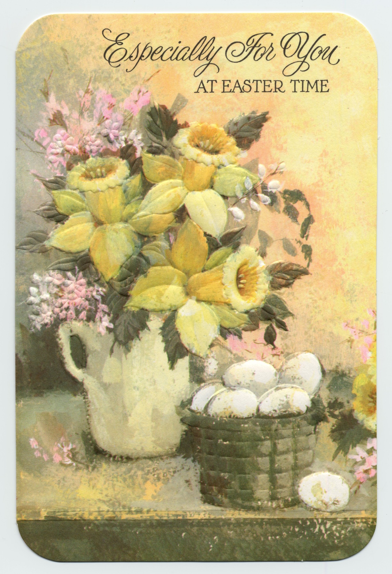 A card with an illustration of daffodils and a basket of eggs on the front.