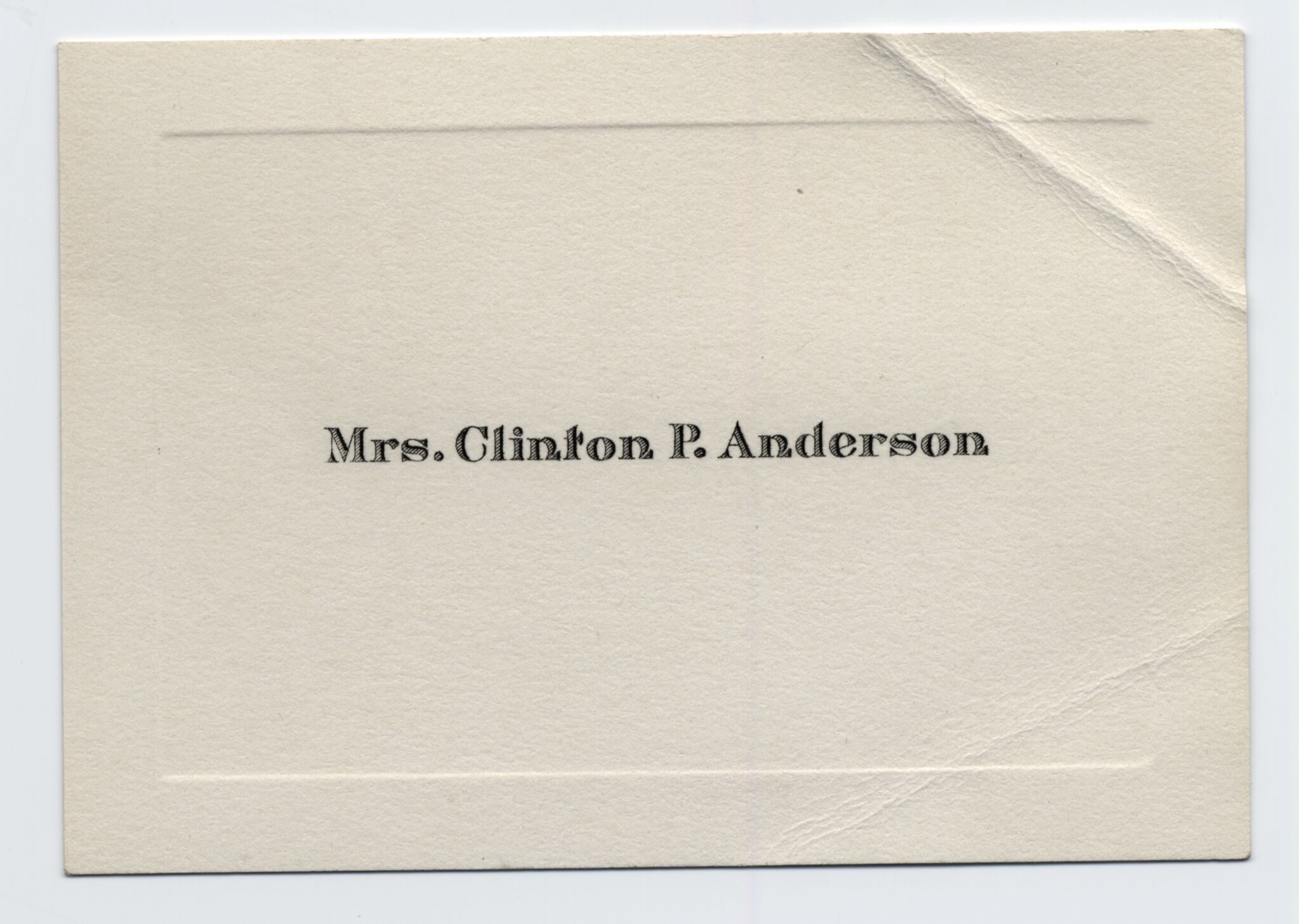 A small calling card with the visitor's name printed in the center.