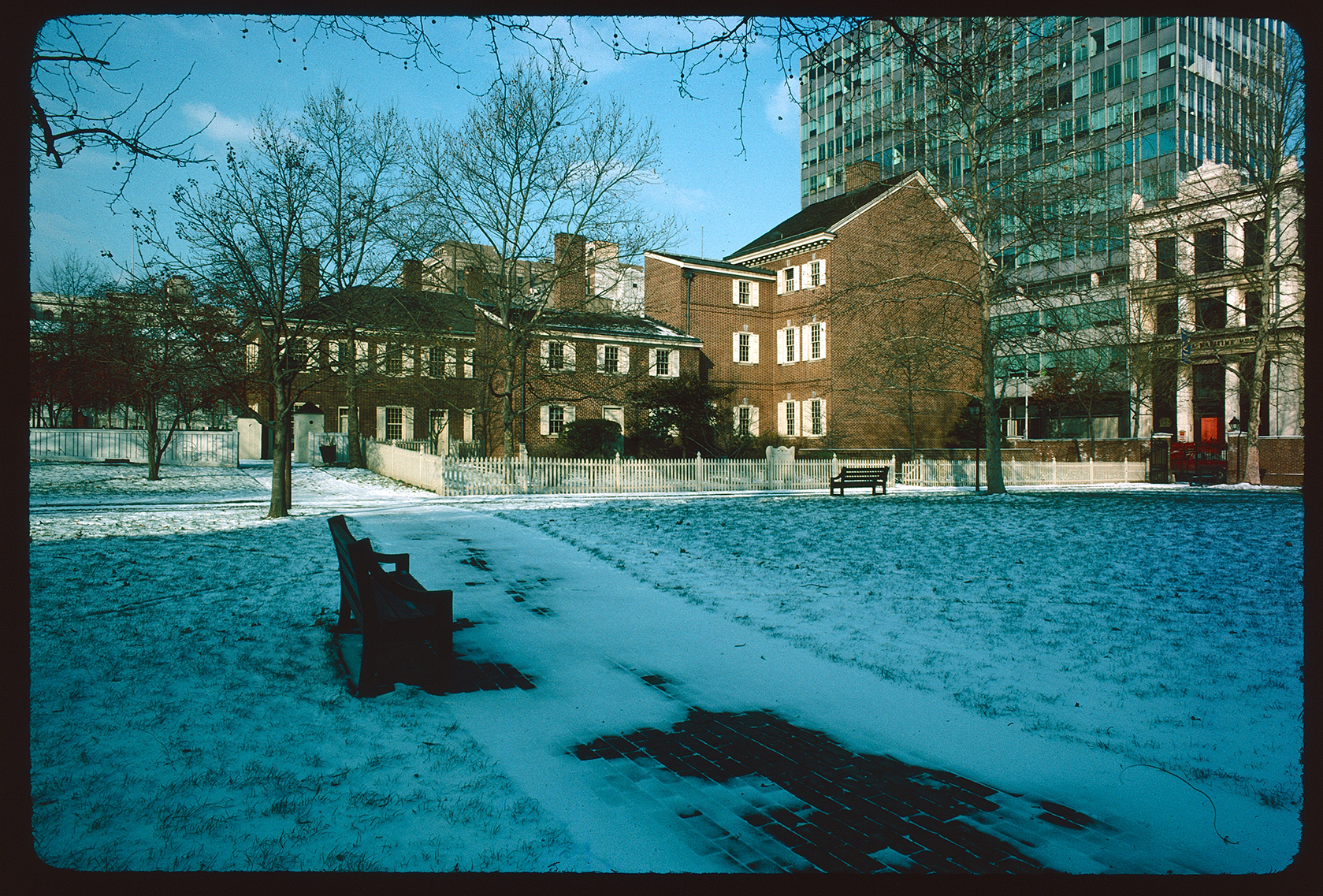 Looking northwest from walkway crossing Hudson's Alley to Carpenters Court. Pemberton House exterior (east side) right center, with New Hall behind it to the left. National Liberty Museum far right. Snow on ground.