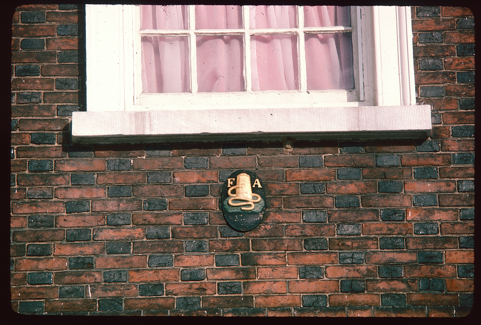 Carpenters Hall. Exterior. FA emblem below center window on south side.