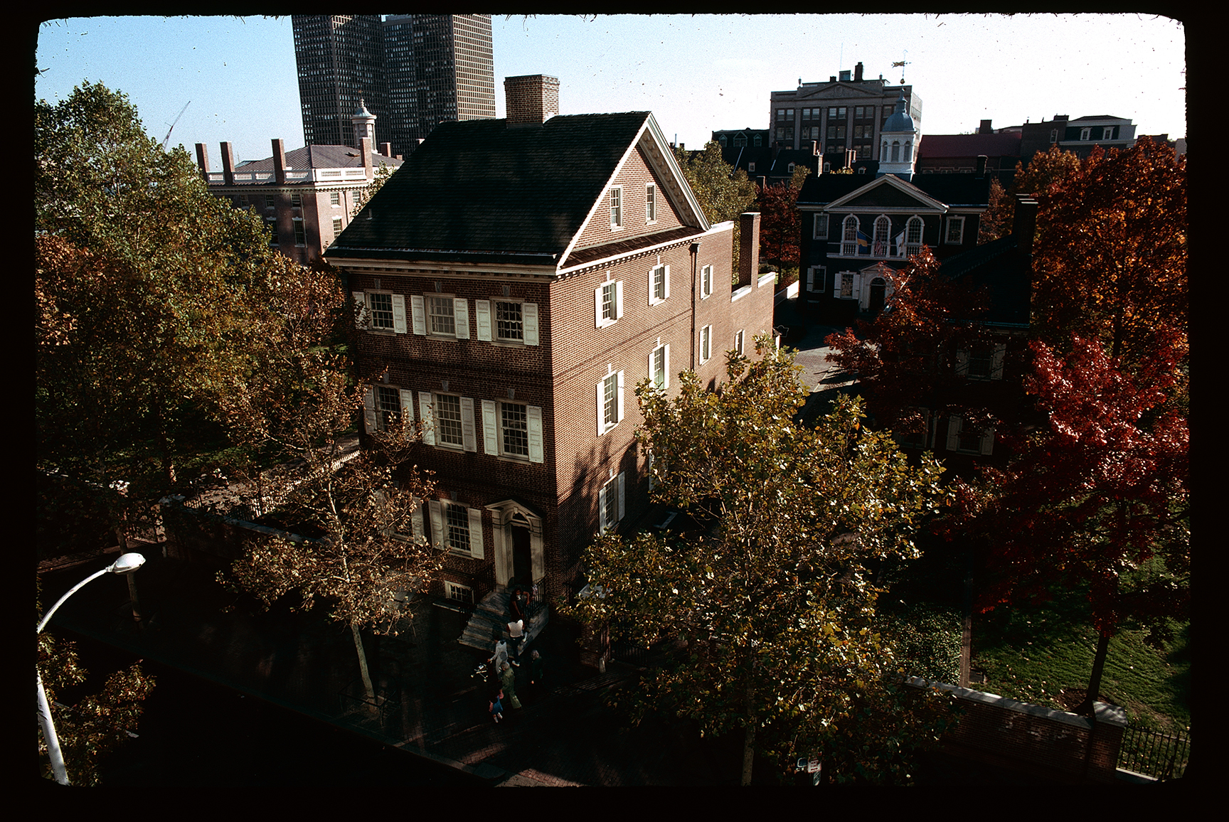 Pemberton House. Exterior. Low aerial view. Looking south past Chestnut Street. Carpenters Hall behind to right.