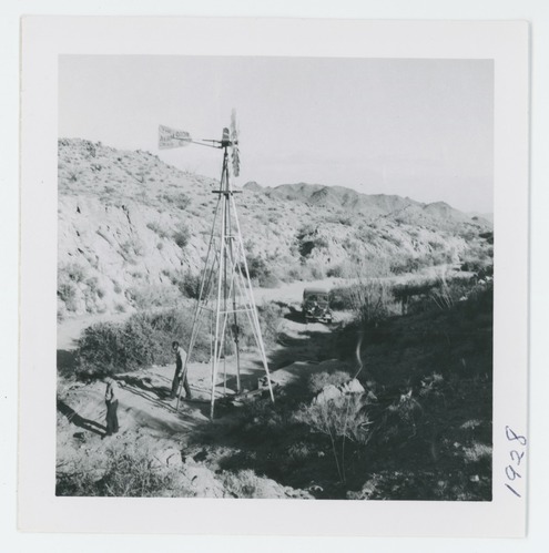 Black and white image of bighorn guzzler, windmill for wildlife in Chuckwalla Mts., and Coxcomb Mts.