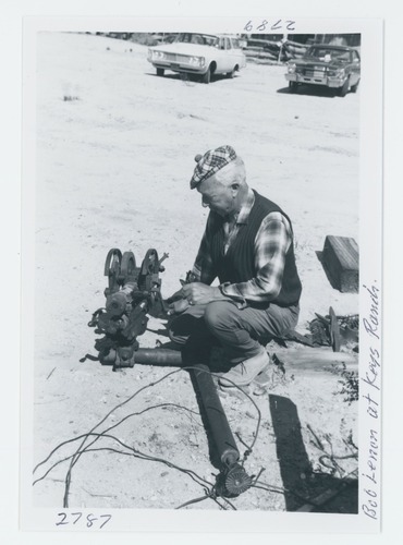 Black and white image of manual jackhammer and Bob Lennon