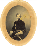 Brigadier General George Armstrong Custer in Military Uniform with Embroidered Sleeves, Wearing Gloves and Clutching a Sword; Seated View