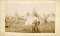 Young Man Afraid of His Horse, an Oglala Sioux in Front of His Tipi Holding a Springfield Carbine