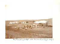 Cowboys from the SL Outfit Eating Near the Chuckwagon