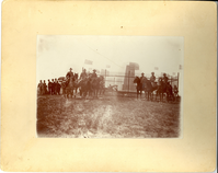 Mounted Soldiers Near the Custer Monument Decorated with US. Flags, Civilians Look O