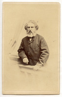 Henry Wadsworth Longfellow standing behind balustrade with his right arm leaning on a pillar. He is holding the balustrade with his left hand. The drapery and general background is very faint. Longfellow is wearing formal clothes and has ear-length hair and a graying beard.
