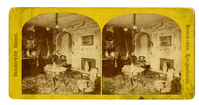 Stereoview of 19th century parlor, featuring Rococo revival style table and Georgian moldings.