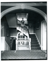 Black and white photograph of arch and staircase.