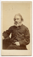 Bearded Henry Wadsworth Longfellow with graying hair is seated facing three-quarter to viewer's left. His right hand rests on a covered table and his left hand lies in his lap. His vest and coat are trimmed.