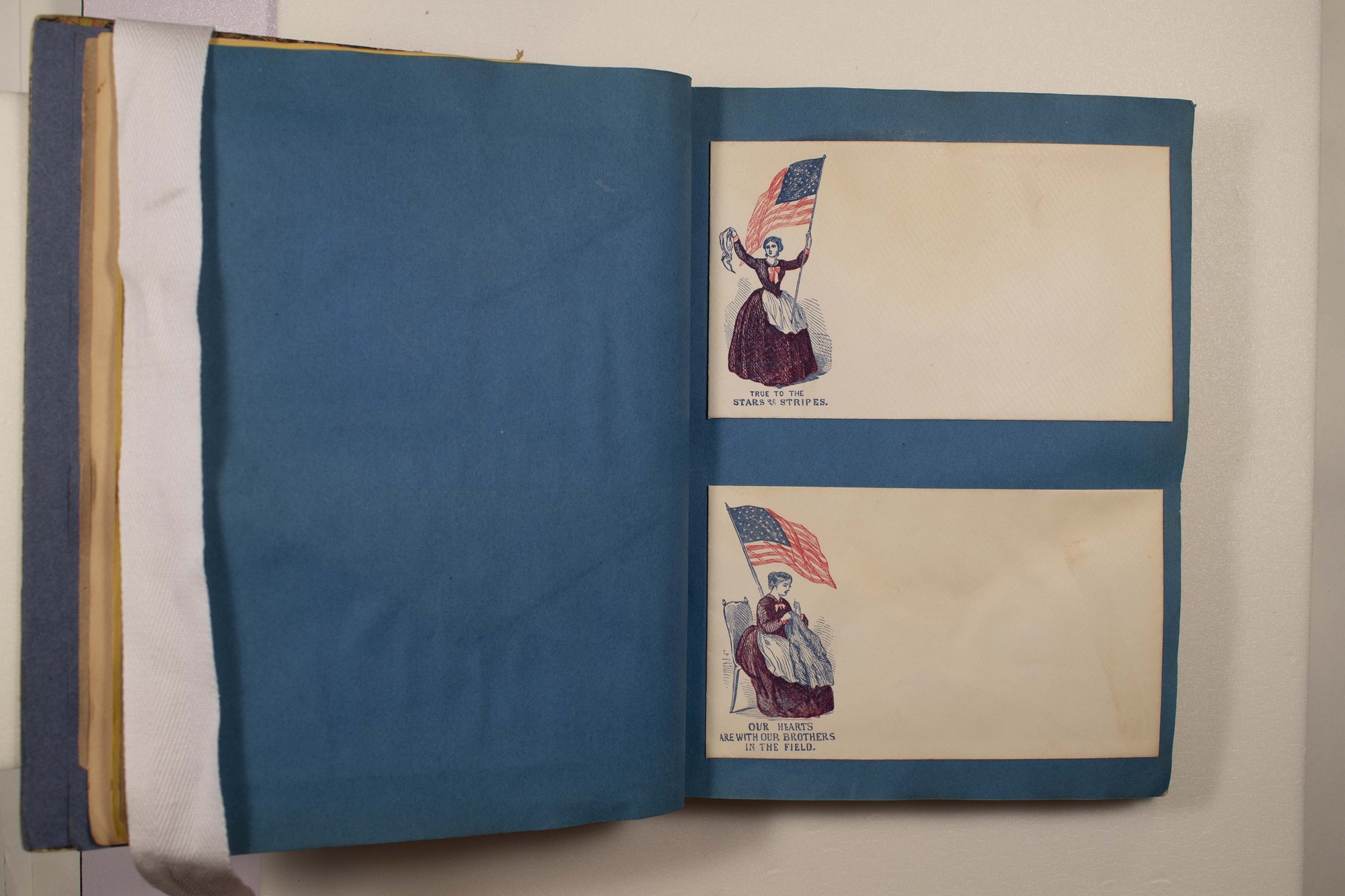 Back of two envelopes which have been glued to page.