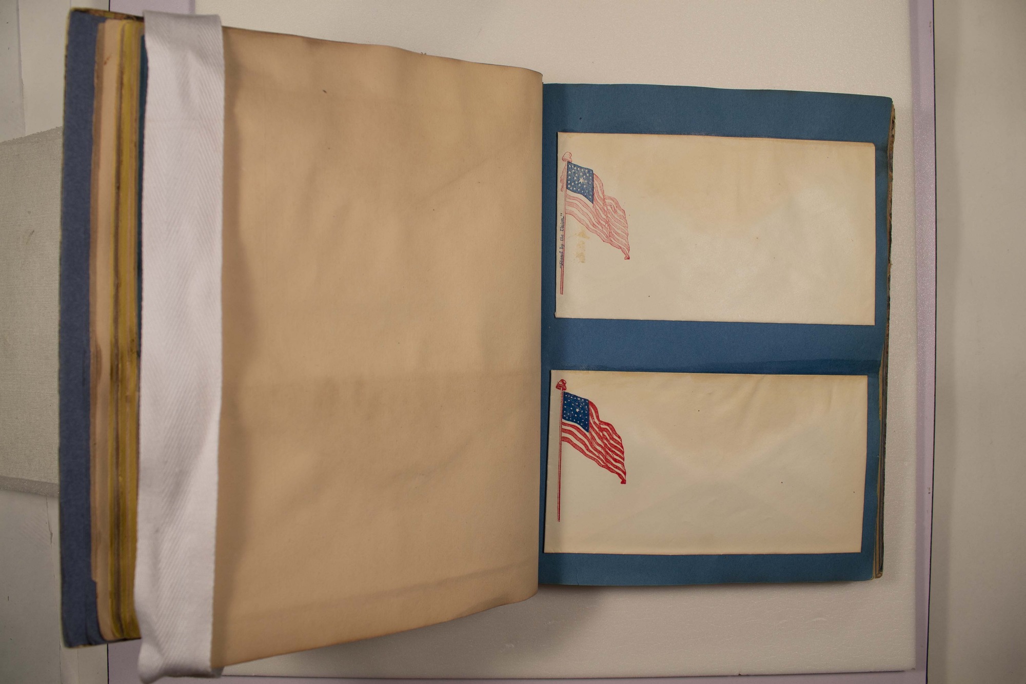 Back of two envelopes which have been glued to page.