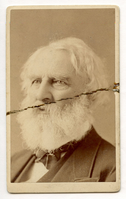 Head and shoulders of Henry Wadsworth Longfellow against plain background. He faces three-quarter view to his right. His neckwear has a slim stripe. Longfellow's ear-length hair is fully white as is his full beard.