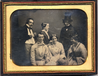 Group portrait of three men and three women in a studio