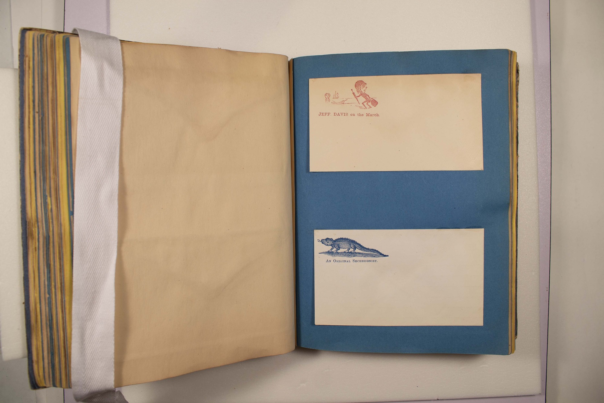 Back of two envelopes which have been glued to page.