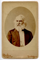 Image in oval. Henry Wadsworth Longfellow in three-quarter view to his right. He is wearing a white vest and a dark jacket with three buttonholes in the lapels. Longfellow has chin-length white hair and a full white beard.