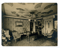 Small 19th century sitting room, decorated with Asian objects, including fans on ceiling.