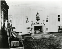 Black and white photograph of large 19th century library.