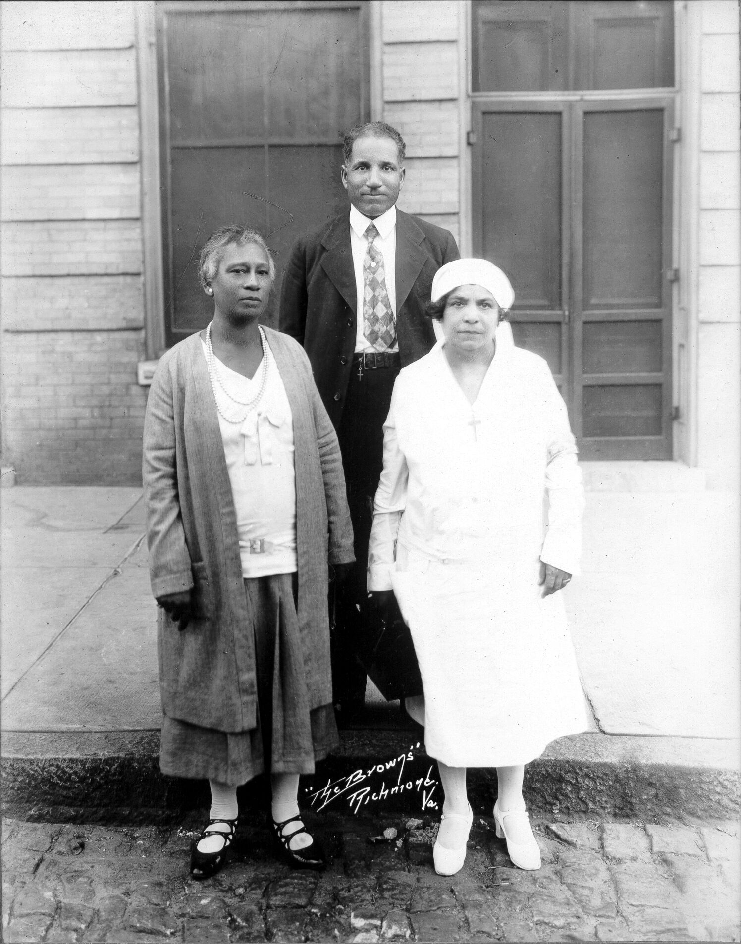 John S. Collins and 2 women