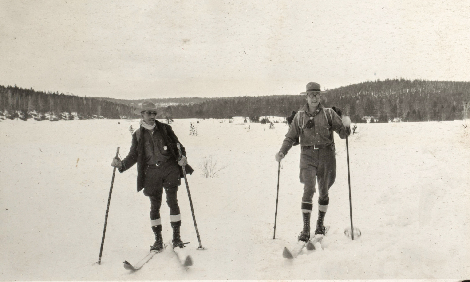 Rangers Frank Childs and Guy McCarty on skis in Virginia Meadows